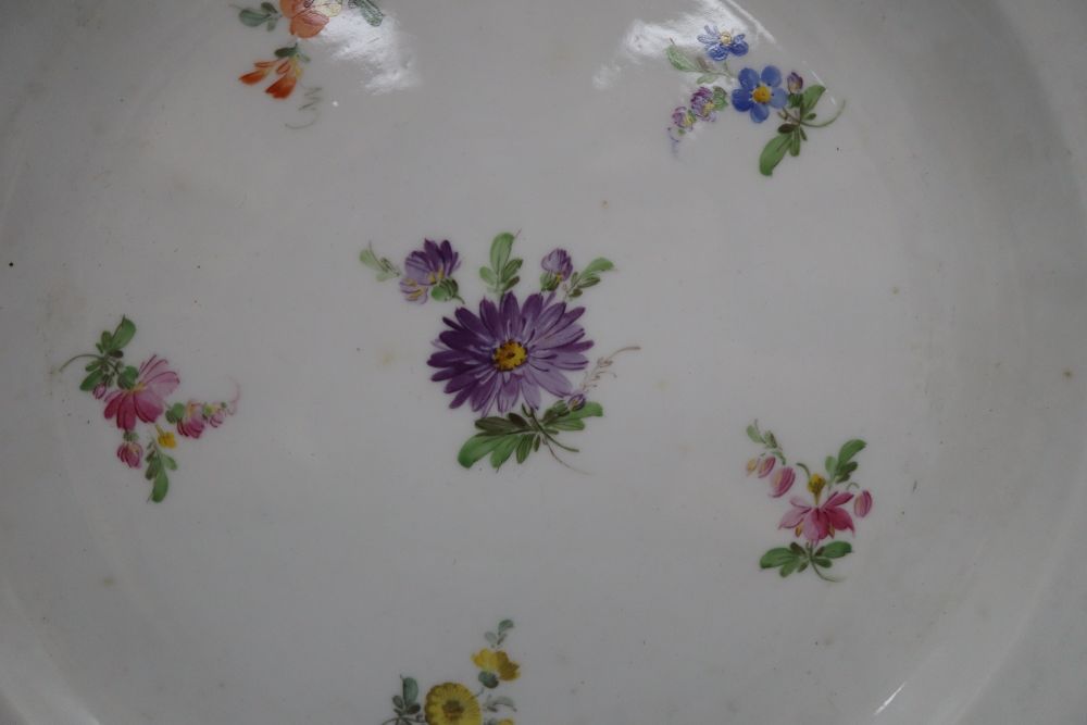 Three Meissen floral and gilt decorated plates, diameter 24cm